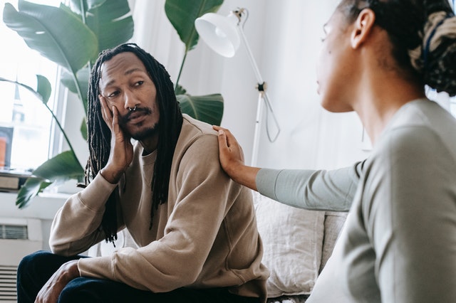 Couple seated talking to each other